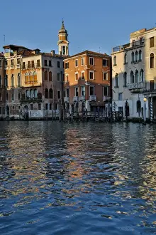 Carnival Prints: Evening light on Grand Canal and its reflection of old buildings and belltower, Venice