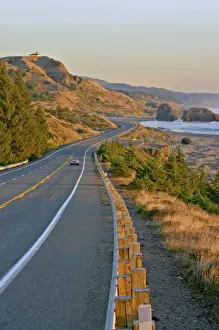 Images Dated 1980: evening lighting car on highway 101 near Gold Beach Oregon