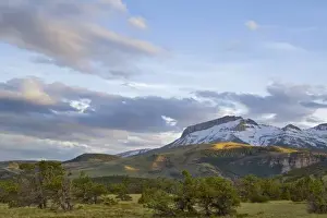 Evenings last light strikes Ear Mountain on the Rocky Mountain Front of Montana