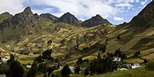 Farmers huts and fields climb up the hillsides in the highlands of Cotopaxi Province