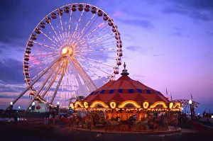 Fair Prints: A ferris wheel and carousel at the Navy Pier in Chicago, Illinois