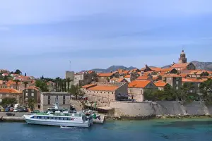 Rampart Prints: Ferry boat with cityscape of Korcula in Adriatic Sea, Croatia