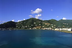 Ferry carrying tourtists to beautiful British Virgin Island with view of capital