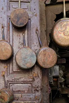 Medina Prints: Fes, Morocco. Antique copper pans for sale in the medina