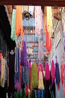 Medina Prints: Fes, Morocco. Skeins of yarn hang to dry after being hand dyed