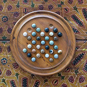 Entry Prints: Fes, Morocco. Wooden game of marbles