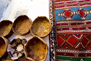 Imperial Prints: Fez Morocco leather baskets & oriental carpet on the wall in the old medina