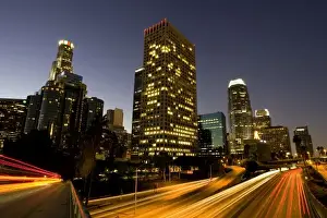 Images Dated 2nd December 2007: First light from sunrise illuminates downtown Los Angeles wih traffic streaking across