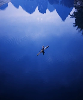 Yangshuo Prints: Fisherman on bamboo raft on Li River, Yangshuo, Guangxi Province, China