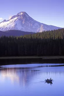 Fishermen in drift boat on Frog Lake sunset with Mt. Hood towering in the background