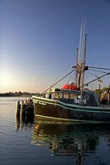 Fishing boat at sunset docked at Yarmouth, Nova Scotia, Canada