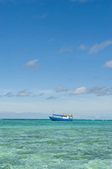 Images Dated 6th July 2011: Fishing boat in the turquoise waters of the blue lagoon, Yasawas, Fiji, South Pacific