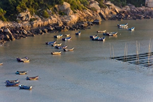 Seaweed Prints: Fishing boats on the muddy beach at sunrise, East China Sea, Xiapu, Fujian, China