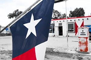 Route 66 Prints: Flag at an antique gas station, Adrian, Texas, USA. Route 66