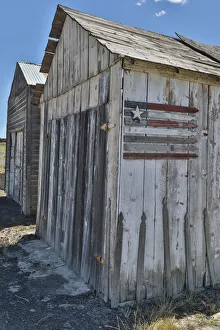 Flag on side of old wooden shed, Benge, Washington State