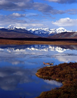 Images Dated 31st August 2007: Float plane on lake, Alaska Mountain Range in the distance. Denali Highway, Alaska