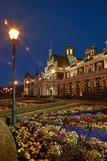 Dark Prints: Flower garden and historic Railway Station at night, Dunedin, South Island, New Zealand