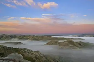 Images Dated 10th June 2008: Fog from the Little Missouri River hangs in the badlands of Theodore Roosevelt National