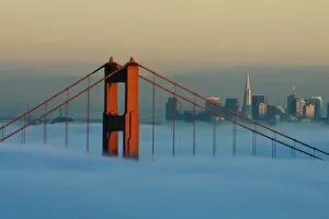 Images Dated 13th November 2007: Fog rolls through the San Francisco bay covering the Golden Gate Bridge and city