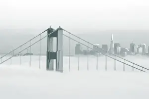 Smog Prints: Fog rolls through the San Francisco bay covering the Golden Gate Bridge and city