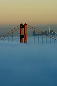 Images Dated 13th November 2007: Fog rolls through the San Francisco bay covering the Golden Gate Bridge and city