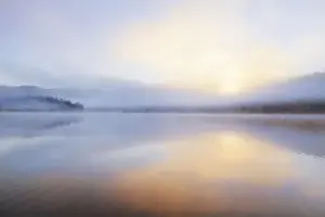 Images Dated 4th June 2011: Foggy sunrise over Beaver Lake in the Stillwater State Forest near Whitefish, Montana