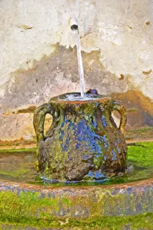 Water Feature Prints: A fountain and urn with running water and moss at Chateau Saint Cosme, Gigondas, Vaucluse