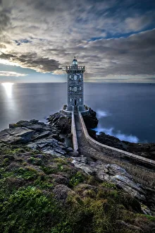 Lookout Prints: France, Brittany, Le Conquet. Sun setting at the Kermorvan Lighthouse