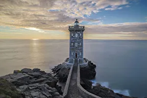 Lookout Prints: France, Brittany, Le Conquet. Sun setting at the Kermorvan Lighthouse