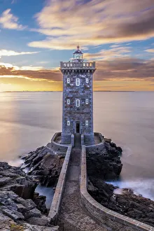 Lookout Prints: France, Brittany, Le Conquet. Sun setting at the Kermorvan Lighthouse