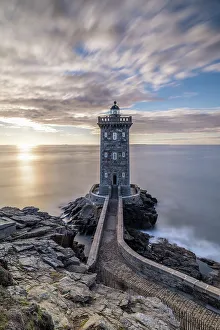Lookout Prints: France, Brittany, Le Conquet. Sun setting at the Kermorvan Lighthouse