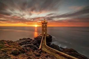Lookout Prints: France, Brittany, Le Conquet. Sun setting at the Kermorvan Lighthouse