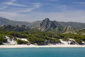 Images Dated 15th June 2008: France, Corsica. White sand and clear water at Saleccio Beach below rugged terrain