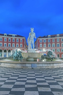 Provence Prints: France, Cote d Azur, Nice. Sun Fountain at Place Massena with Statue of Apollo at dawn