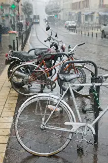 Images Dated 5th March 2005: FRANCE-French Alps (Isere)-GRENOBLE: Bikes in the Snow / Place Notre Dame / Winter