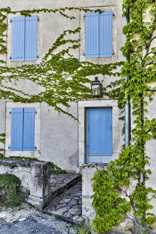 France, Lot River Valley. Home with blue shutters