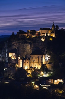 France, Midi-Pyrenees Region, Lot Department, Rocamadour, elevated town view, dusk
