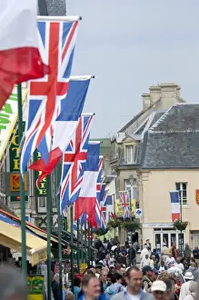 French Culture Prints: France, Normandy, Arromanches. Ceremonial flags line the streets of Normandy for