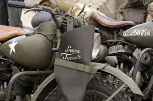 Select Focus Prints: France, Normandy, Arromanches. Vintage military motorcycles on famous battlefield