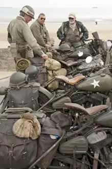 France, Normandy, Arromanches. Vintage military motorcycles on famous battlefield