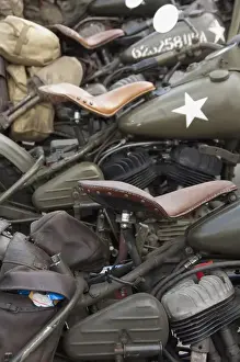 France, Normandy, Arromanches. Vintage military motorcycles on famous battlefield