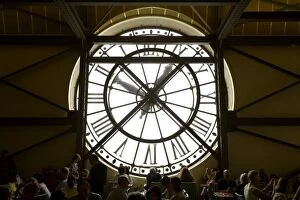 France, Paris. Diners behind one of the famous clocks in the Musee d Orsay. Credit as