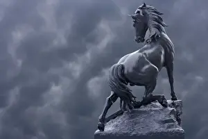 Statuary Prints: France, Paris. Horse sculpture against storm clouds at entrance of Musee d Orsay