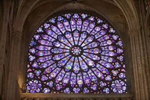 France, Paris. Interior detail of stained glass window in Notre Dame Cathedral. Credit as