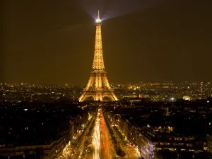 Traffic Prints: France, Paris. Nighttime view of Eiffel Tower and Champs Elysees (digital composite)