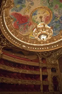 Chandelier Prints: France, Paris. Part of ornate ceiling and tiers of seating at Opera Garnier