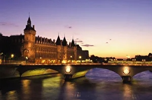 Conciergerie Prints: France, Paris, River Seine and Conciergerie at dusk