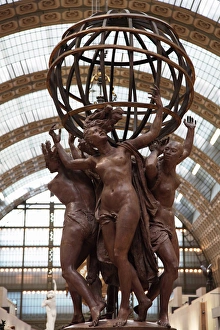 France. Paris. The statue of Four Parts of the World supporting the Sphere by Jean-Baptiste France. Paris. The statue of Four Parts of the World supporting the Sphere by Jean-Baptiste