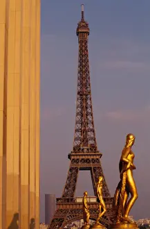 Tour Eiffel Prints: France, Paris, Tour Eiffel and Palais de Chaillot statue at sunset