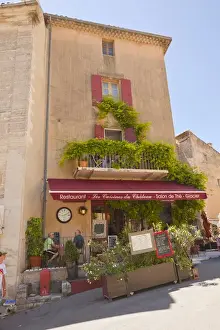 Fred J Lord Prints: France, Provence, Gorde. Outside diners at restaurant and ice cream salon. Credit as